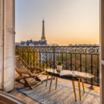 beautiful paris balcony at sunset with eiffel tower view