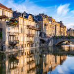 METZ, FRANCE - AUG 5, 2022: The old town architecture of Metz at the Moselle river, France